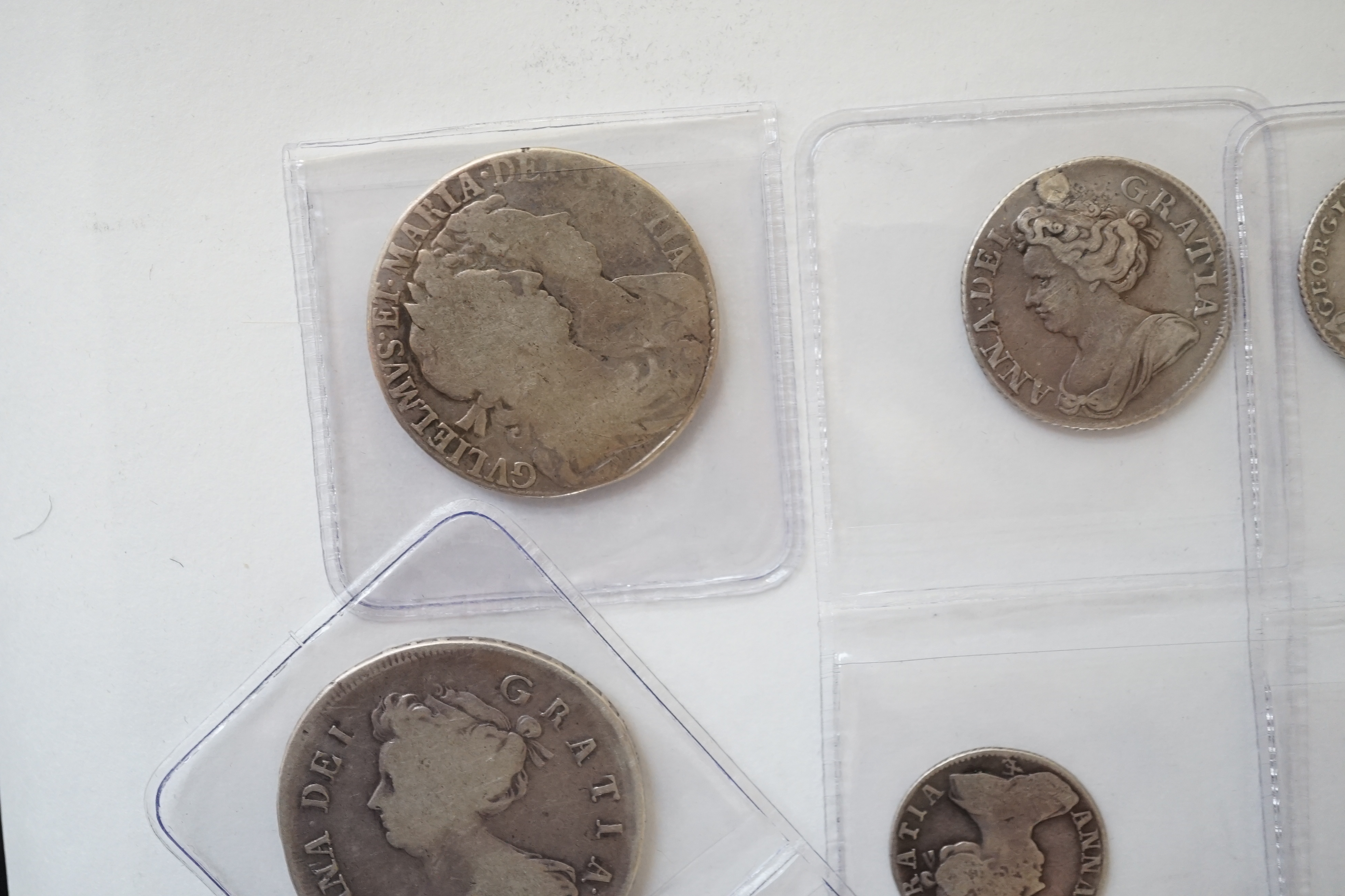 British milled silver coins, Stuart to Georgian, comprising William and Mary and halfcrown, 1689, William III halfcrown, 1697E, Anne halfcrown, 1707E, shilling, 1711, plugged hole otherwise fine, sixpence, 1708E, George
